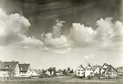 I-12-032-German village-tidy village with clouds above copy