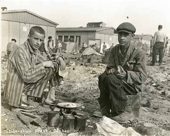 J-9-025-Dachau-Survivors eating copy